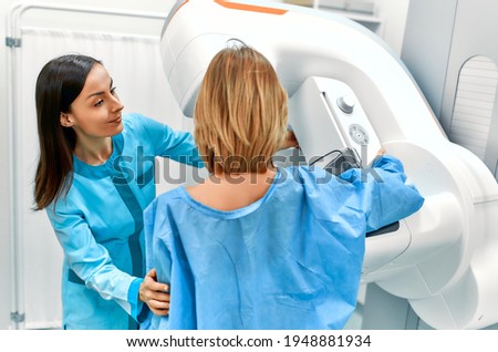 In the hospital, the patient undergoes a screening procedure for a mammogram, which is performed by a mammogram. A modern technologically advanced clinic with professional doctors.