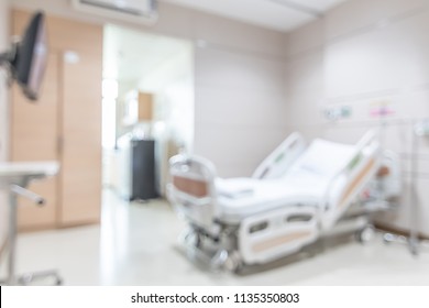 Hospital patient ward or ICU intensive care unit blur background with blurry medical empty bed room interior for nursing care and health treatment service backdrop  