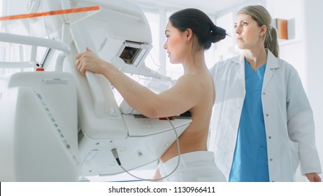 In the Hospital, Portrait Shot of Topless Female Patient Undergoing Mammogram Screening Procedure. Healthy Young Female Does Cancer Preventive Mammography Scan. Modern Hospital with High Tech Machines