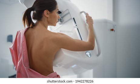 In the Hospital, Portrait Shot of Topless Multiethnic Female Patient Undergoing Mammography Screening Procedure. Healthy Adult Caucasian Woman Does Cancer Preventive Mammogram Scan in Radiology Room.