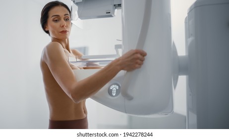 In the Hospital, Portrait Shot of Topless Multiethnic Female Patient Undergoing Mammography Screening Procedure. Healthy Adult Female Does Cancer Preventive Mammogram Scan in Radiology Room.