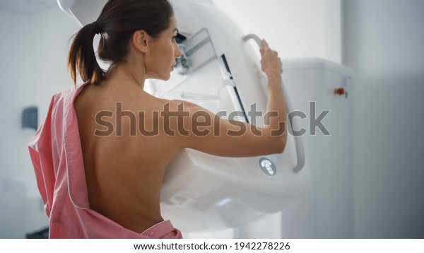 In the Hospital, Portrait Shot of Topless\
Multiethnic Female Patient Undergoing Mammography Screening\
Procedure. Healthy Adult Caucasian Woman Does Cancer Preventive\
Mammogram Scan in Radiology\
Room.