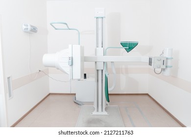 Hospital Radiology Room. X-ray Department In Modern Hospital. Medical Equipment. Scan Machine For Fluorography. Technician Adjusting An Xray Machine. Scanning Chest, Heart, Lungs In Modern Clinic