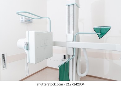 Hospital Radiology Room. X-ray Department In Modern Hospital. Medical Equipment. Scan Machine For Fluorography. Technician Adjusting An Xray Machine. Scanning Chest, Heart, Lungs In Modern Clinic