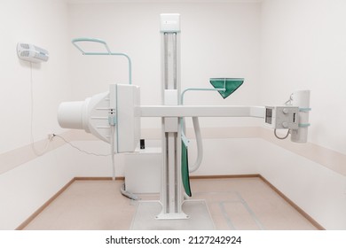 Hospital Radiology Room. X-ray Department In Modern Hospital. Medical Equipment. Scan Machine For Fluorography. Technician Adjusting An Xray Machine. Scanning Chest, Heart, Lungs In Modern Clinic