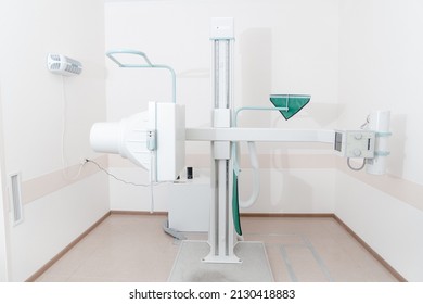 Hospital Radiology Room. X-ray Department In Modern Hospital. Medical Equipment. Scan Machine For Fluorography. Technician Adjusting An Xray Machine. Scanning Chest, Heart, Lungs In Modern Clinic