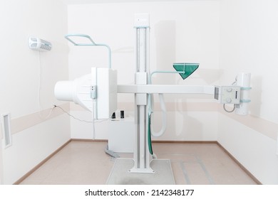 Hospital Radiology Room. X-ray Department In Modern Hospital. Medical Equipment. Scan Machine For Fluorography. Technician Adjusting An Xray Machine. Scanning Chest, Heart, Lungs In Modern Clinic