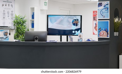 Hospital Reception Counter In Clinic Lobby To Help Patients And Doctors With Consultations And Medical Appointments. Empty Reception Desk In Waiting Area Room, Healthcare Center.