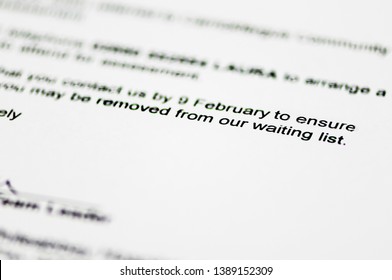 Hospital referral letter warning patient that they could be removed from the waiting list. - Shutterstock ID 1389152309