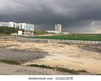 Hospital And Residence View On A Dark Cloudy Day