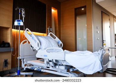 Hospital room for patients. Medical bed (functional bed for bedridden patients). Medical equipment. - Powered by Shutterstock