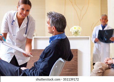 Hospital Scene. Doctors And Patients.