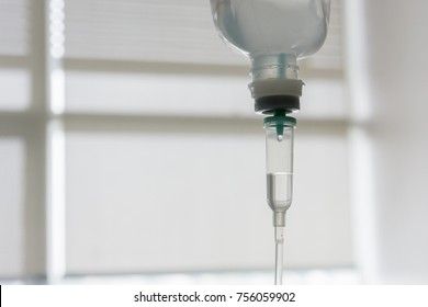 Hospital Scene Of Intravenous Drip Treatment (IV) For Patient With Dehydration Problem. Soft Focus.