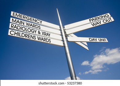 Hospital Signage Pointing Different Directions For Wards