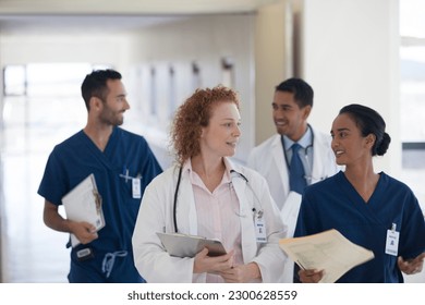 Hospital staff talking in hallway - Powered by Shutterstock