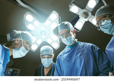 Hospital, surgery and team of doctors in operating room for emergency crisis, medical service or procedure. Healthcare, discussion and surgeons with patient pov for injury, wellness and ICU treatment - Powered by Shutterstock