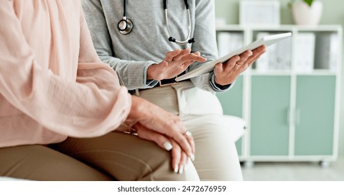 Hospital, tablet and hands of doctor with patient for consulting, medical service and help in clinic. Healthcare, telehealth and people on digital tech for diagnosis, online results and insurance - Powered by Shutterstock