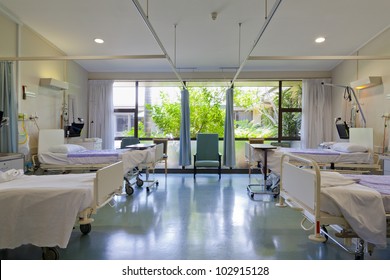 Hospital ward with beds and medical equipment in modern private hospital for COVID-19 Pandemic - Shutterstock ID 102915128