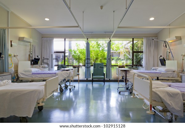 Hospital ward with beds and medical\
equipment in modern private hospital for COVID-19\
Pandemic