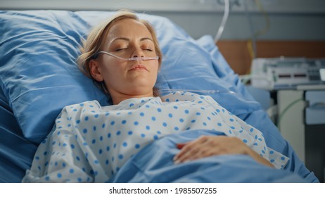 Hospital Ward: Portrait Of Beautiful Young Woman Sleeping In Bed, Fully Recovering After Sickness. Female Patient Dreaming About Her Happy Healthy Future.