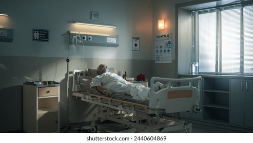 Hospital Ward: Portrait of Indian Elderly Man Wearing Oxygen Mask Sleeping in Bed, Recovering after Sickness and Successful Surgery. Senior Man Dreaming of His Family and Happy Healthy Life - Powered by Shutterstock