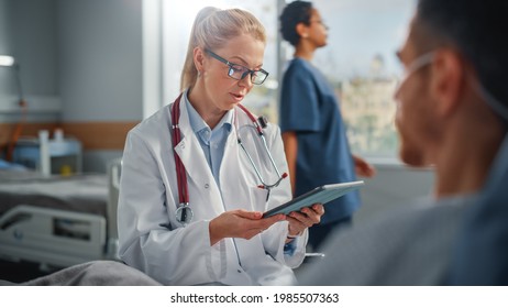 Hospital Ward: Resting in Bed Caucasian Male Patient Listens to Experienced Female Doctor Explaining Test Results, Gives Advice, Used Tablet Computer. Man Recovering after Successful Surgery, Sickness - Powered by Shutterstock