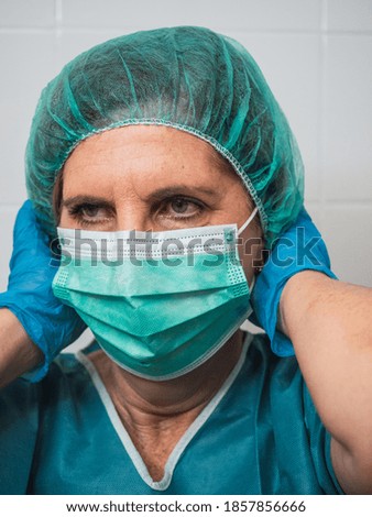 Hospital worker person with protective equipment for coronavirus Covid 19 