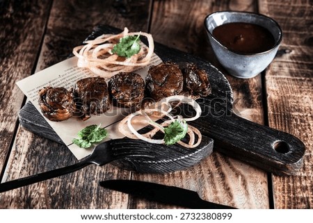 Host festive gathering featuring assorted grills and flavorful sauces