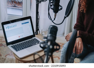 Host Recording Radio Podcast Interview With Guest At Home Studio - Focus On Computer Laptop Screen.