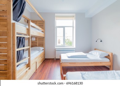 Hostel dormitory beds arranged in room