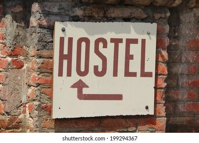 Hostel Sign On Brick Wall Background