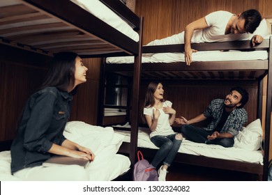 Hostel for Young People. Best Friends Traveling. Small Room in Hostel. spend time Together. bunk beds in room. Friends Sleeping. overnight in Hostel. sitting with boys. communicate. laugh
