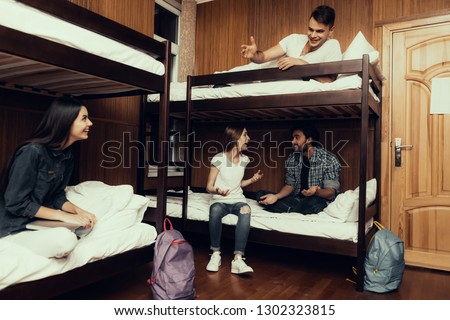 Hostel for Young People. Best Friends Traveling. Small Room in Hostel. spend time Together. bunk beds in room. Friends Sleeping. overnight in Hostel. got up first. sitting with boys. communicate
