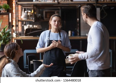 Hostile angry restaurant client couple or friends talking with waiting staff in public place complains about cold coffee long service, spoiled tasteless dish waitress feels guilty mixed orders concept - Powered by Shutterstock