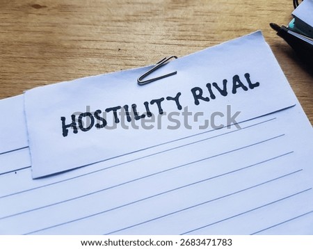 Hostility rival writting on table background.