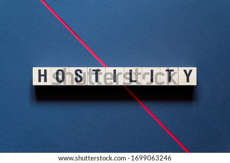 Hostility word concept on cubes