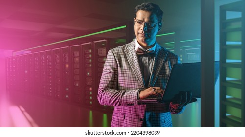 Hosting Provider. Man With Laptop In Server Room. Hosting Company Manager. Guy In Business Suit With Computer. Man In Data Center. Hosting Business. Careers In Field Of Telecommunications