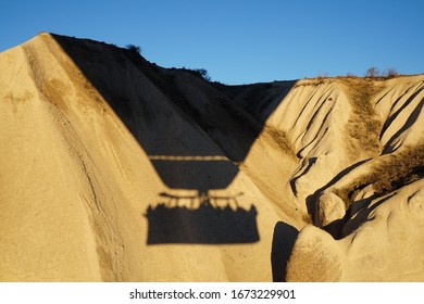 Hot Air Ballon Shadow On The Rock