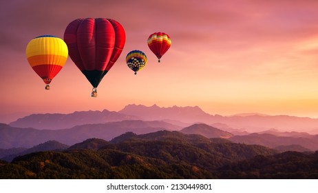 Hot air balloon above high mountain at sunrise, sunset. View of mountain with hot air balloons on morning at Thailand. - Powered by Shutterstock