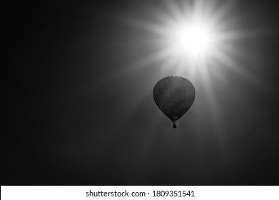 Hot Air Balloon Drifting Slowly Near The Sun