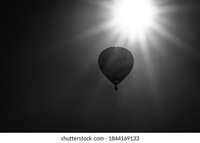 Hot Air Balloon Drifting Slowly Near The Sun