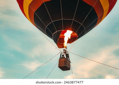 A hot air balloon with a fire in the middle of it - Powered by Shutterstock