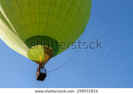 Hot air balloon flight view from below in the blue sky