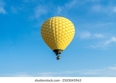 hot air balloon floating in the blue sky - Powered by Shutterstock