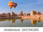Hot air balloon flying over ancient Temple of Karnak in Luxor - Ruined Thebes Egypt