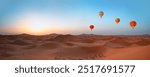 Hot air balloon flying over beautiful sand dunes in the Sahara desert - Sahara, Morocco