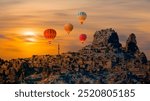 Hot air balloon flying over spectacular Cappadocia -  Goreme, Turkey