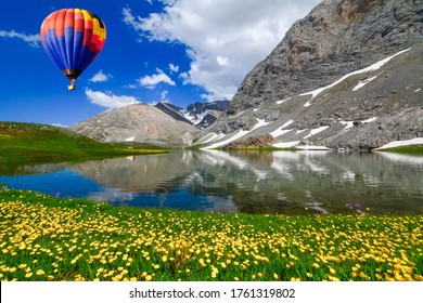 Hot air balloon flying over amazing black Lake ( Karagol ) in Turkey