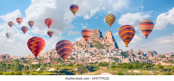 Hot Air Balloon Flying Over Spectacular Cappadocia, Uchisar Castle In The Background - Goreme, Turkey