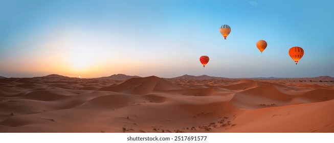 Hot air balloon flying over beautiful sand dunes in the Sahara desert - Sahara, Morocco - Powered by Shutterstock